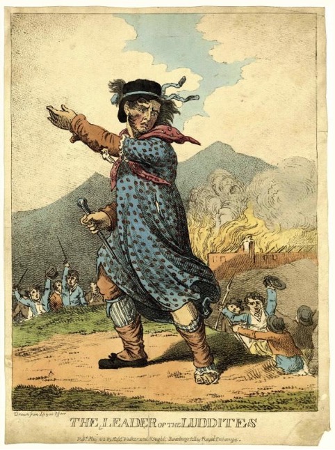 An old card with a cartoon illustration of what looks like a man in a blue dress with black polka dots who is holding a spike and gesturing as though to spur on followers. At the bottom are the words "the leader of the Luddites".